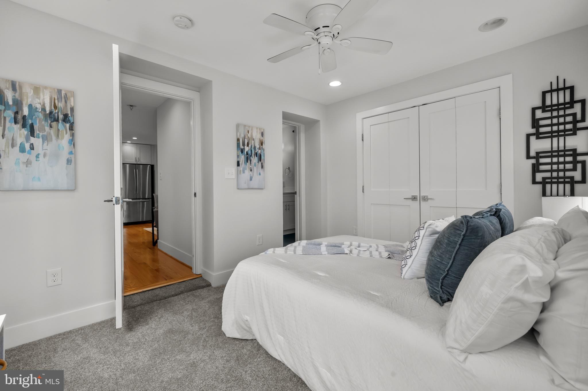 1627 Holbrook Street Northeast, Unit 2 Washington, DC 20002 - Photo 11 of 24 a bedroom with a bed and a painting
