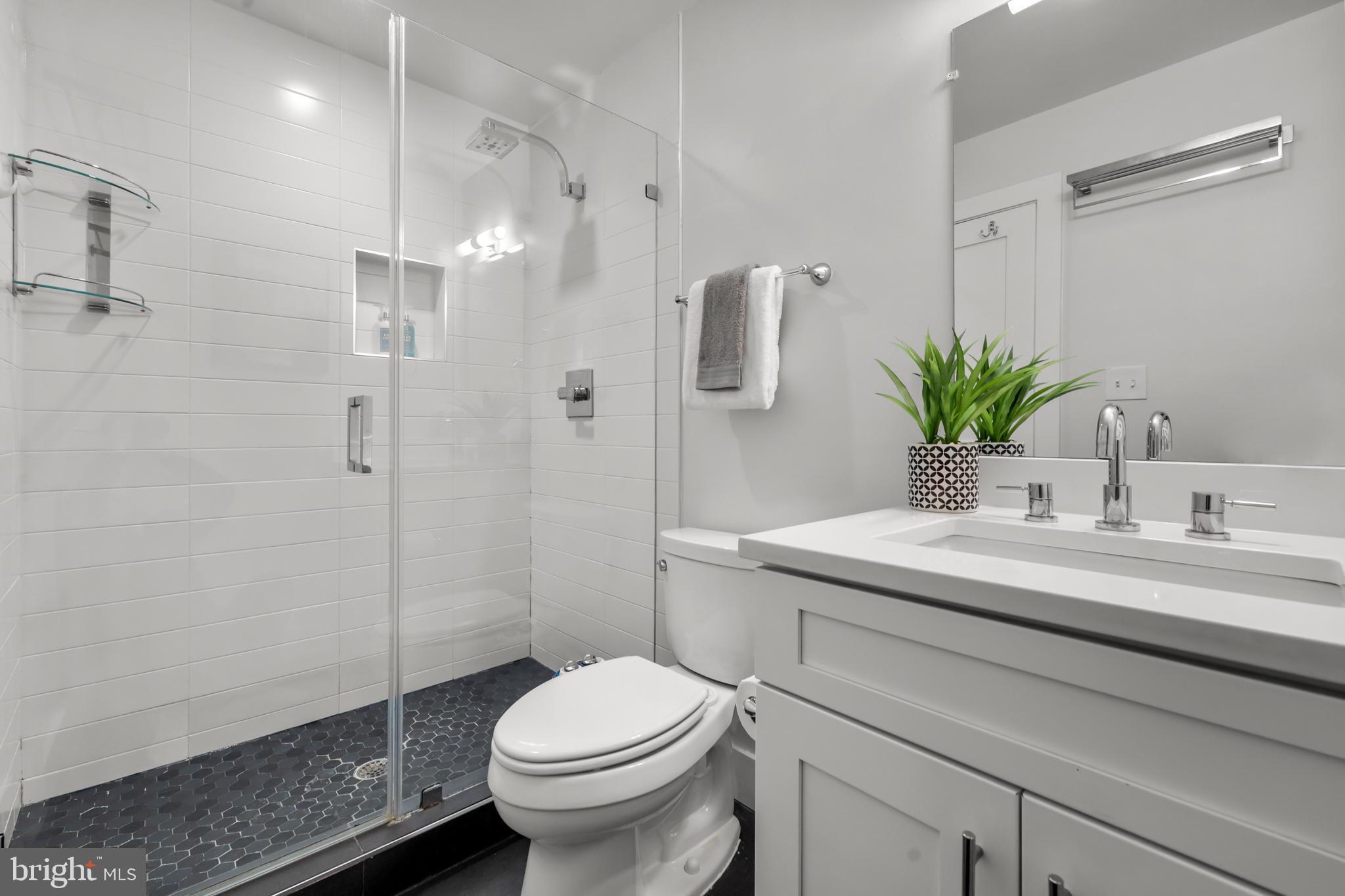 1627 Holbrook Street Northeast, Unit 2 Washington, DC 20002 - Photo 13 of 24 a bathroom with a sink toilet and shower