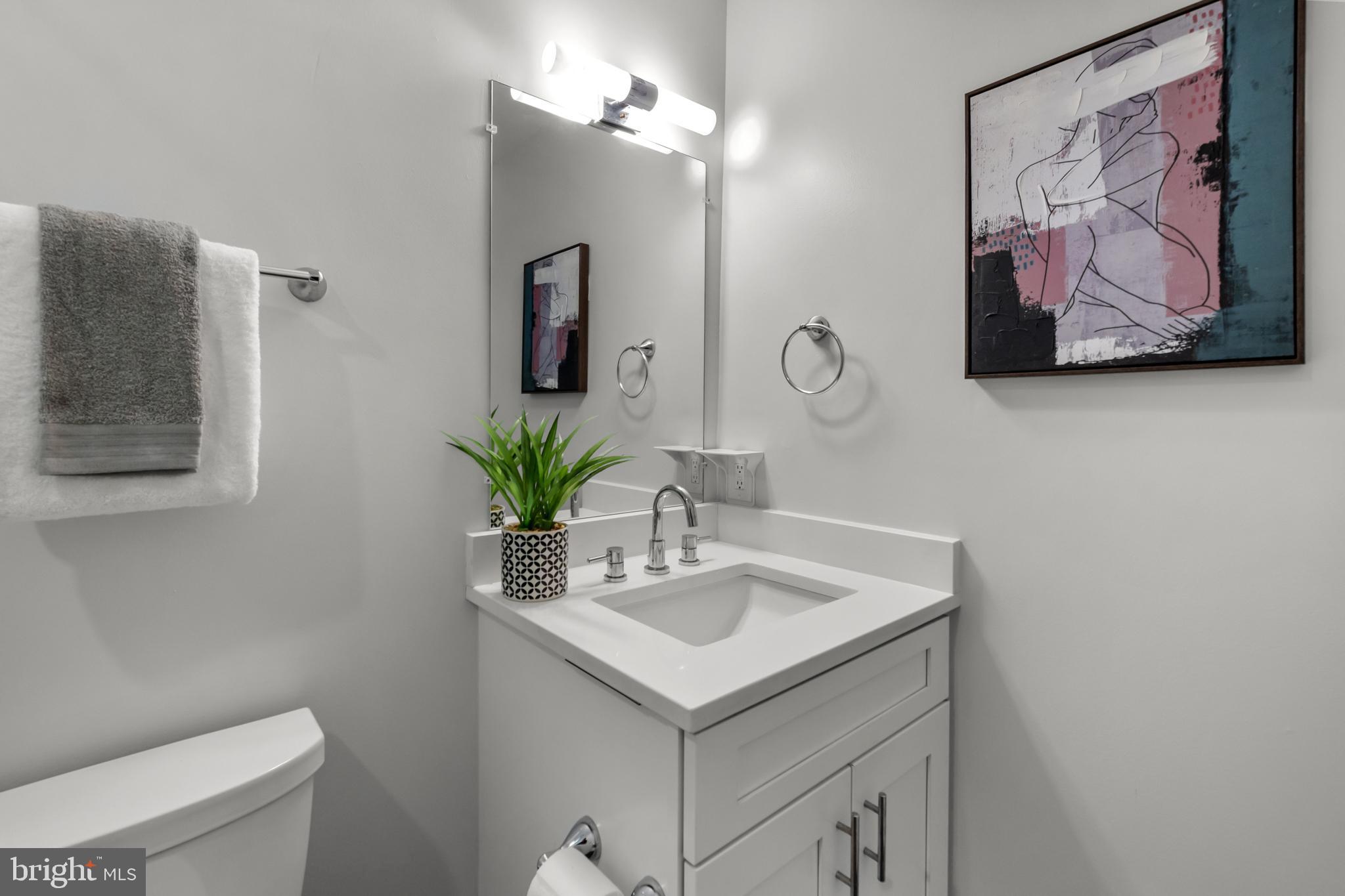 1627 Holbrook Street Northeast, Unit 2 Washington, DC 20002 - Photo 14 of 24 a bathroom with a sink a vanity and a toilet