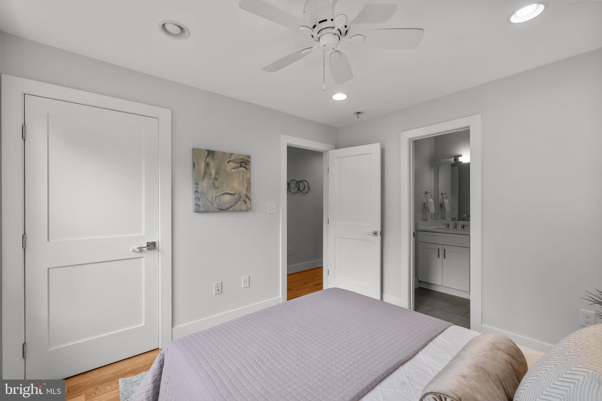 1627 Holbrook Street Northeast, Unit 2 Washington, DC 20002 - Photo 17 of 24 a bedroom with a bed and a chandelier