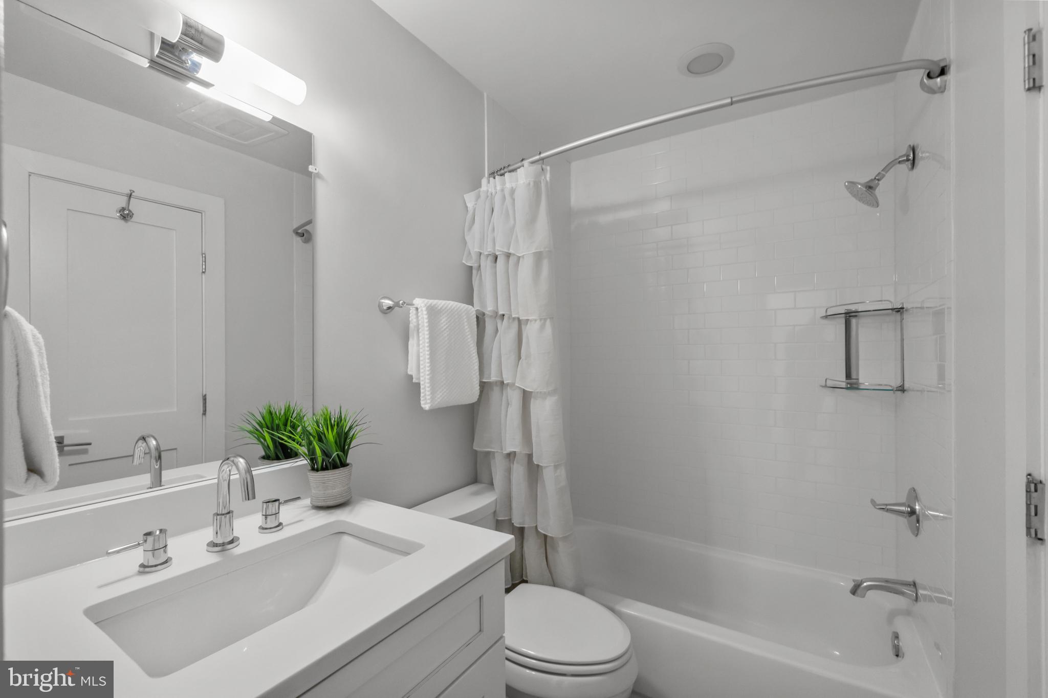 1627 Holbrook Street Northeast, Unit 2 Washington, DC 20002 - Photo 18 of 24 a bathroom with a sink toilet and shower