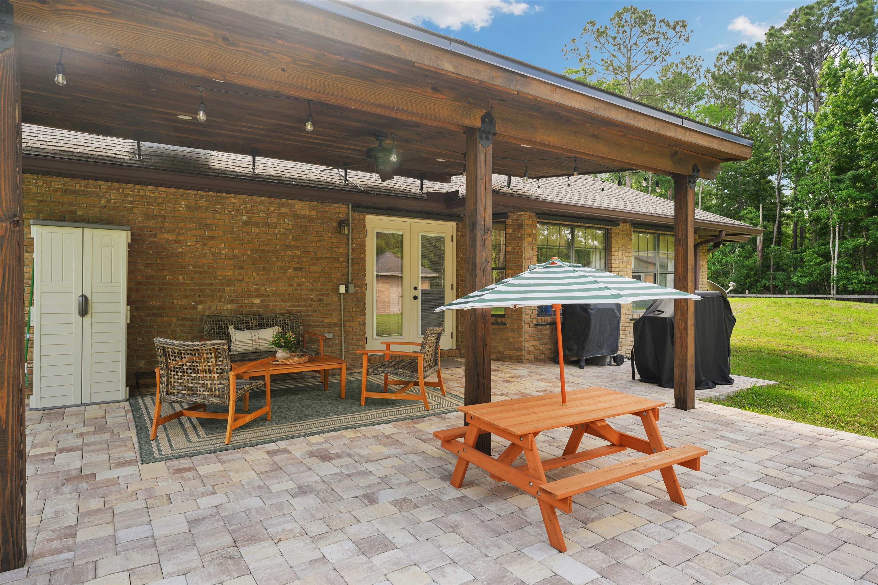 1805 Bennett Road St. Augustine, FL 32092 - Photo 38 of 65 a view of a patio with a table and chairs