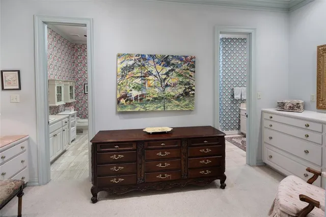 a room with a dresser and a mirror