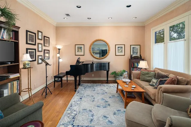 a living room with furniture and a clock