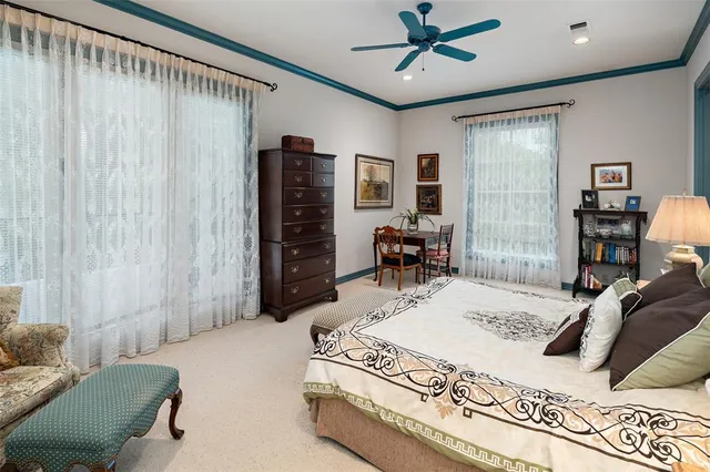 a bedroom with a bed dresser and a window