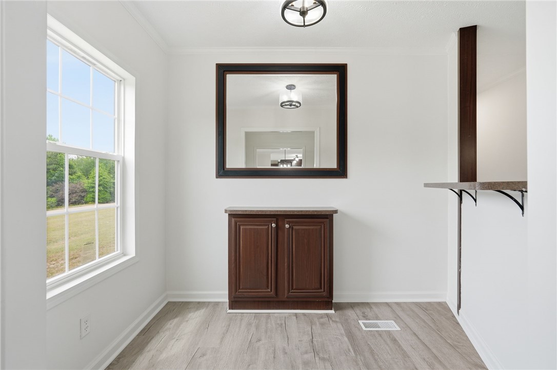 112 Sir Francis Drake Way Liberty, SC 29657 - Photo 14 of 42 This bright space offers a delightful spot for meals and gatherings, complemented by elegant wood flooring.