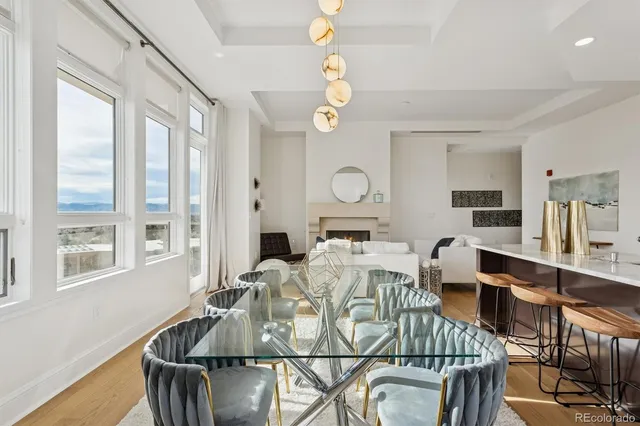 a living room with furniture a dining table and chairs