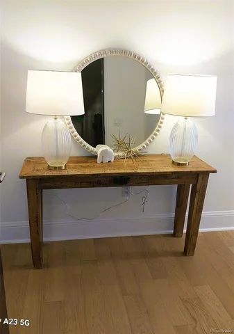 a view of dining room with wooden floor and furniture