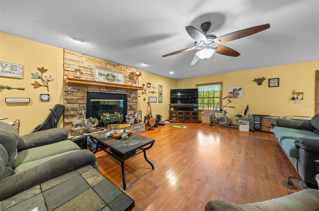 732 Carl Wilson Road Fort White, FL 32038 - Photo 15 of 80 a living room with furniture and a fireplace