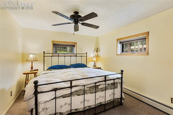 a bedroom with a bed and a table