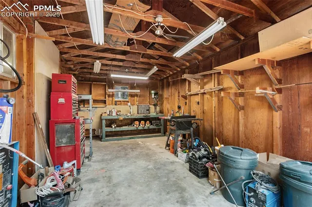 a view of a storage room with water heater and racks