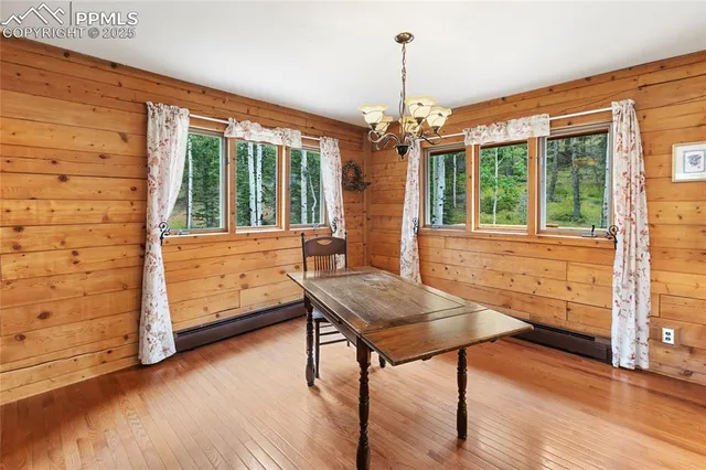 a view of a livingroom with furniture window and wooden floor