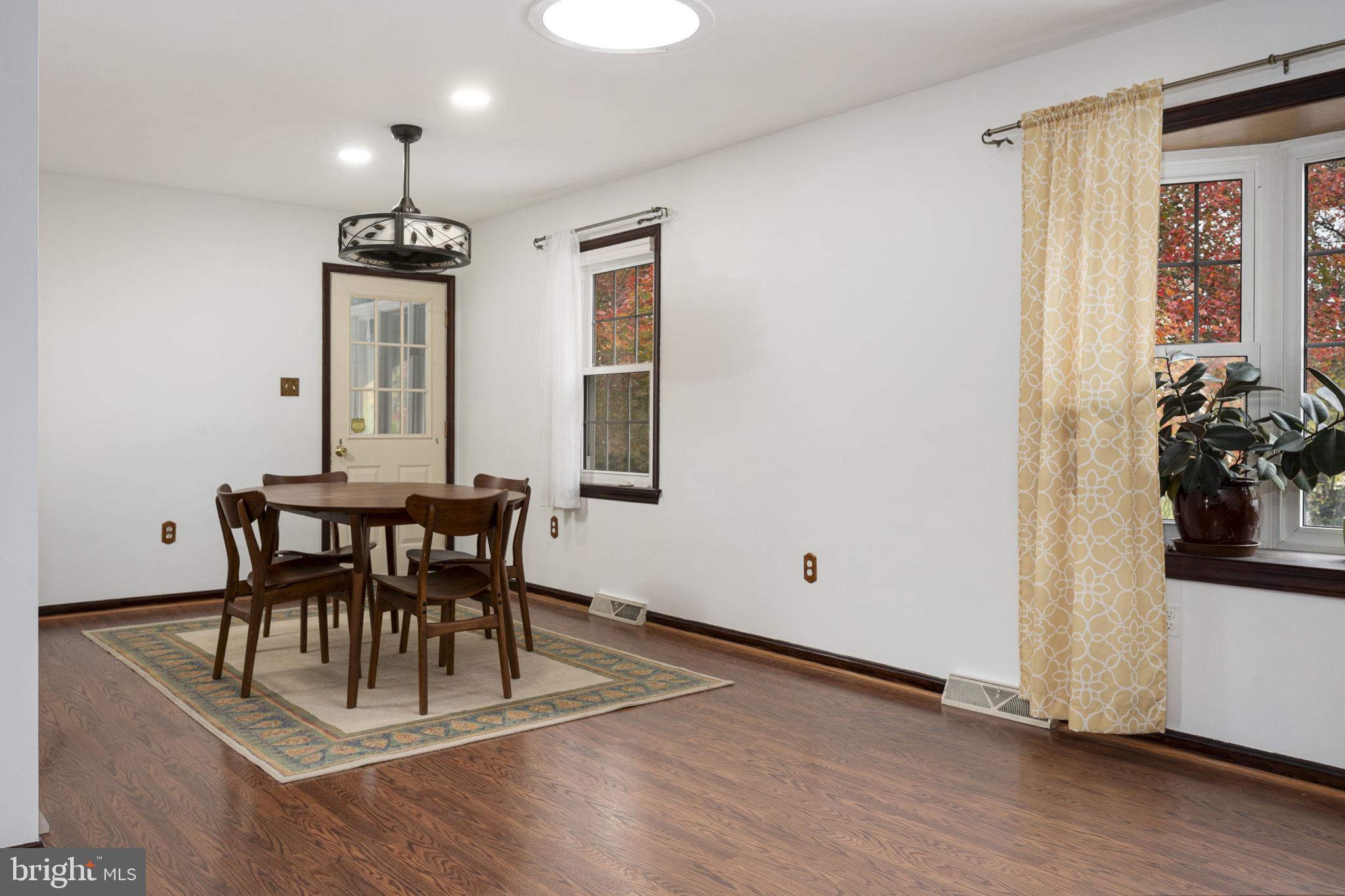 46 Green Acre Road Lititz, PA 17543 - Photo 14 of 44 a view of a dining room with furniture and wooden floor