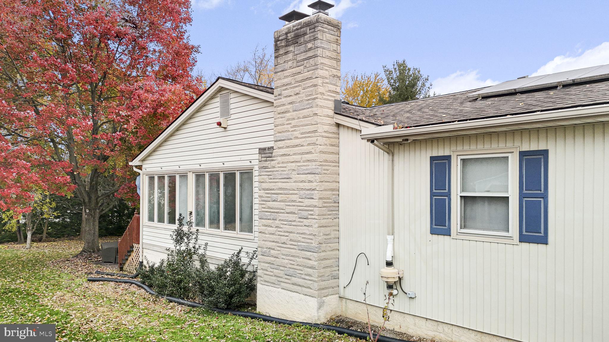 46 Green Acre Road Lititz, PA 17543 - Photo 32 of 44 a view of a house with a yard and potted plants
