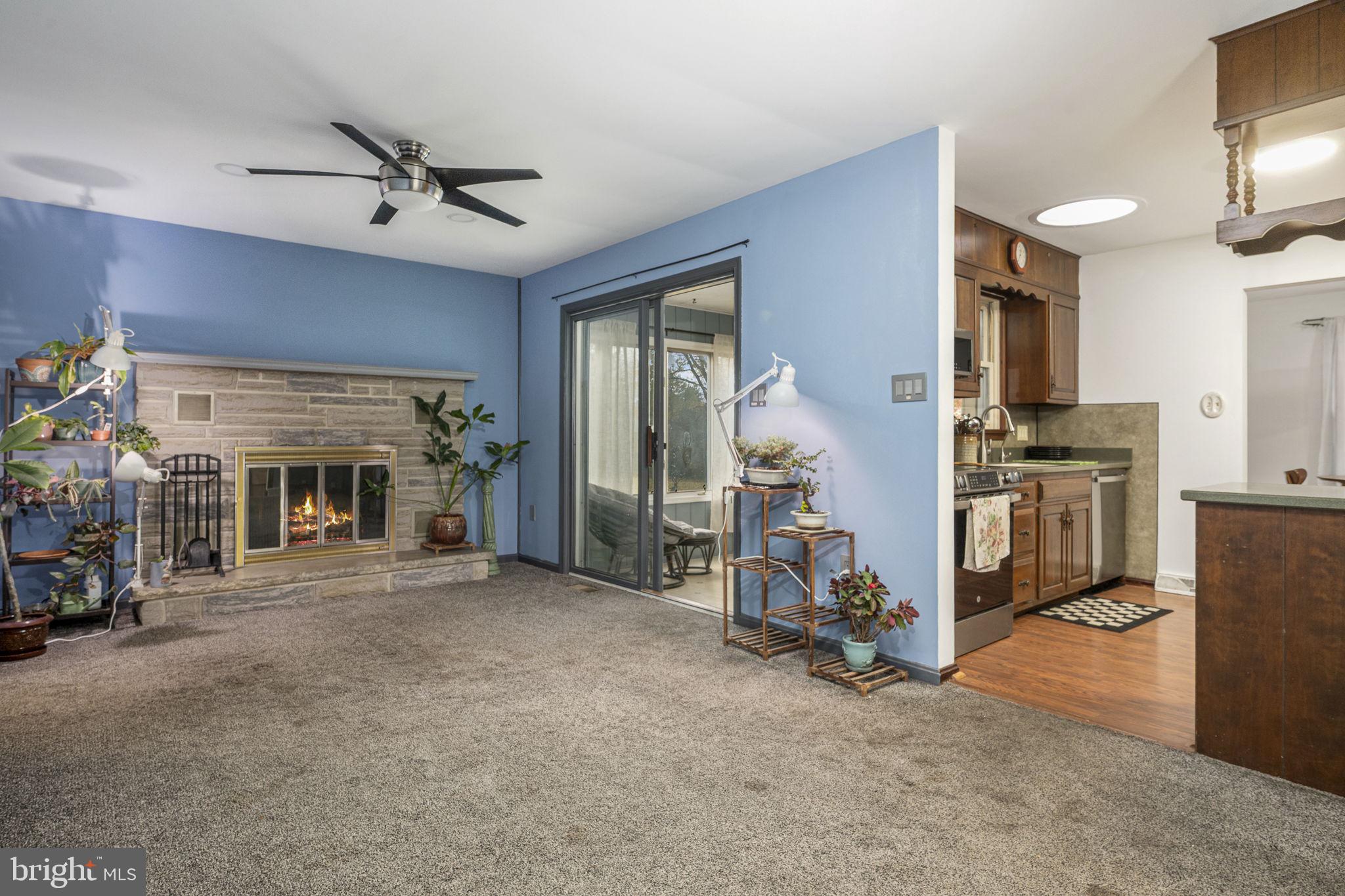 46 Green Acre Road Lititz, PA 17543 - Photo 5 of 44 a view of a livingroom with a fireplace gym equipment and windows