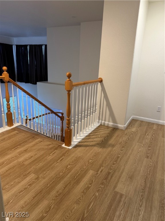 2733 Chokecherry Avenue Henderson, NV 89074 - Photo 14 of 26 Stairway featuring wood finished floors and baseboards