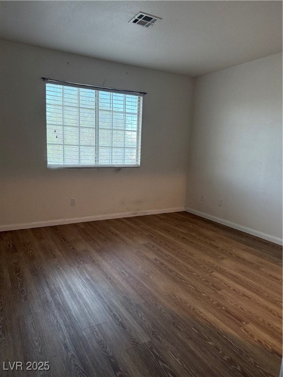 2733 Chokecherry Avenue Henderson, NV 89074 - Photo 21 of 26 Empty room featuring dark wood finished floors