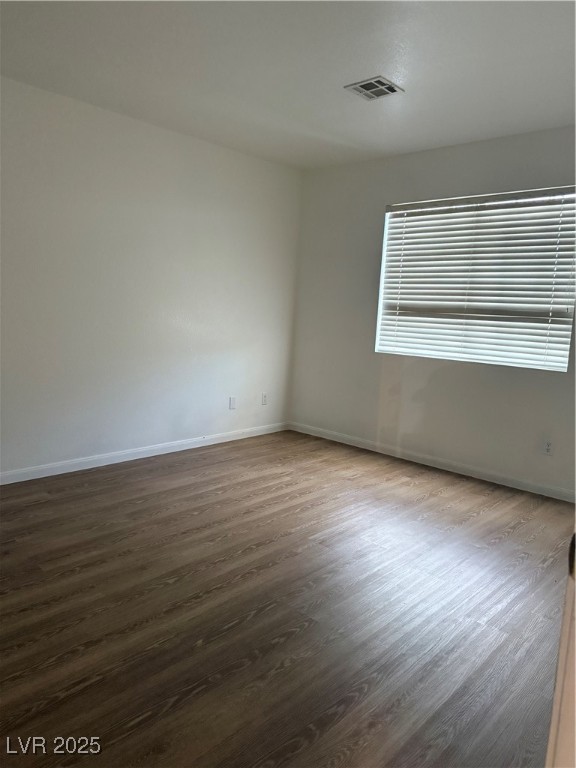 2733 Chokecherry Avenue Henderson, NV 89074 - Photo 22 of 26 Unfurnished room with dark wood finished floors and baseboards