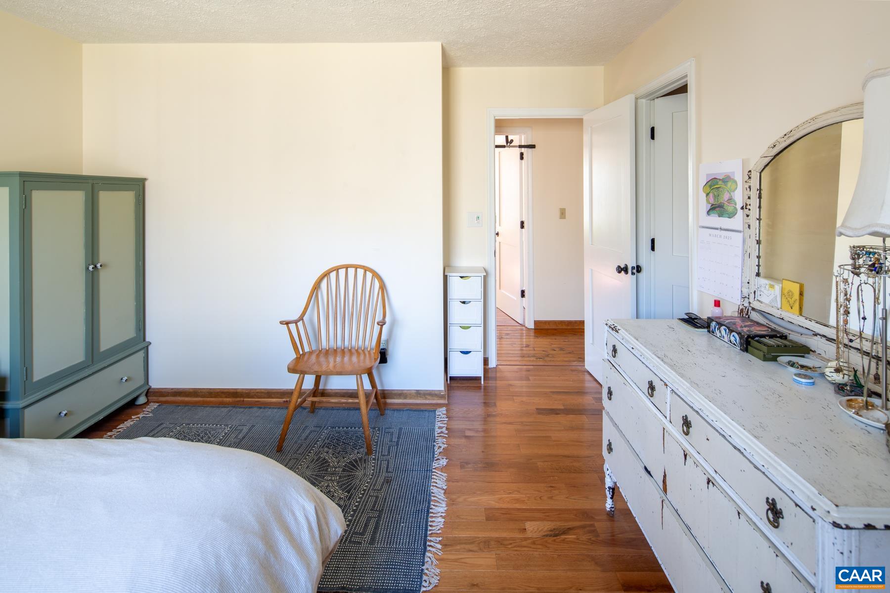 150 Buckingham Circle Charlottesville, VA 22903 - Photo 13 of 27 a bedroom with a bed and a sink