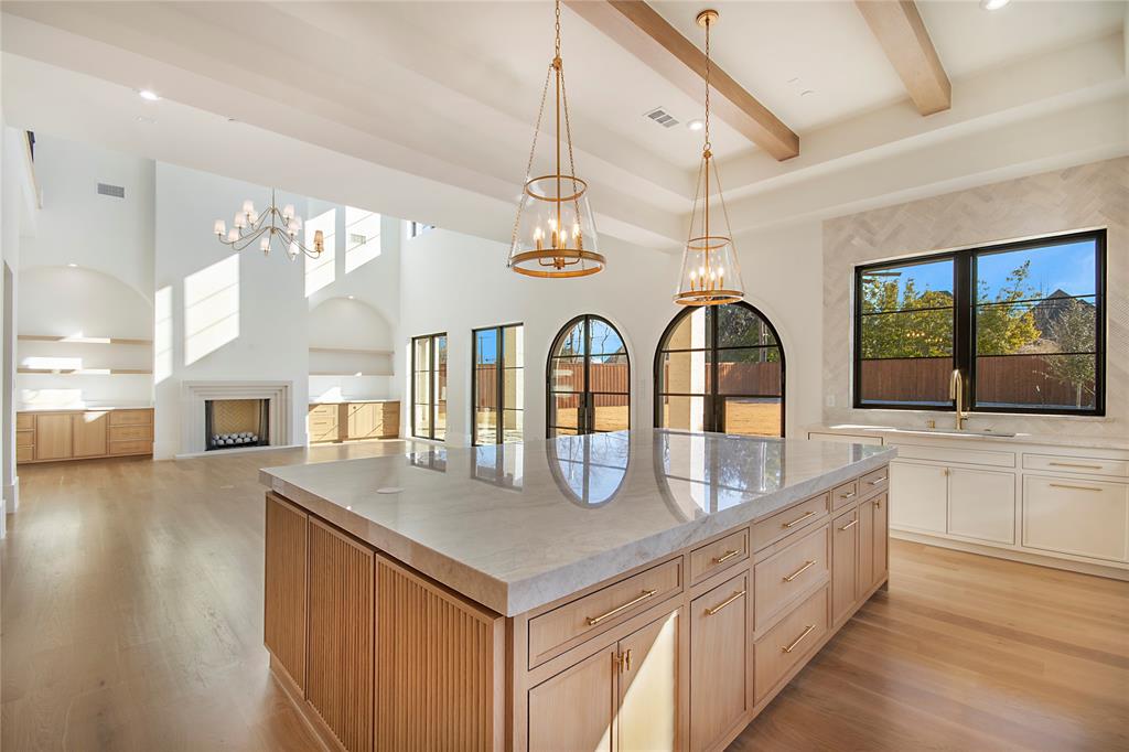 4222 Middleton Road Dallas, TX 75229 - Photo 13 of 40 a kitchen with stainless steel appliances granite countertop a stove and a wooden floors