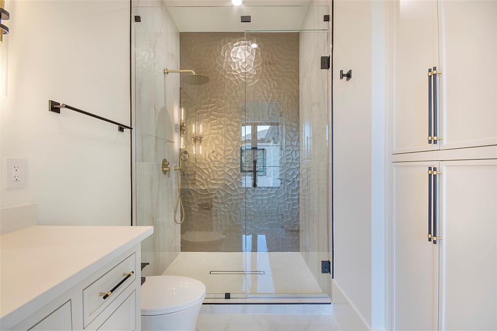 4222 Middleton Road Dallas, TX 75229 - Photo 32 of 40 a bathroom with a shower a toilet and sink