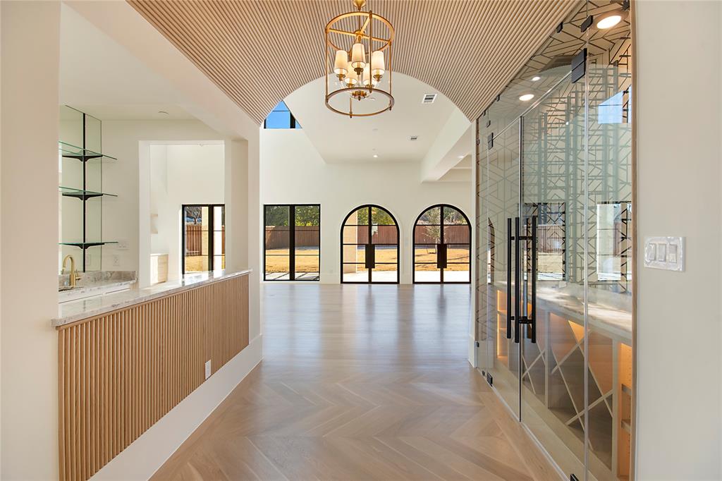4222 Middleton Road Dallas, TX 75229 - Photo 7 of 40 a view of interior space with chandelier and wooden floor