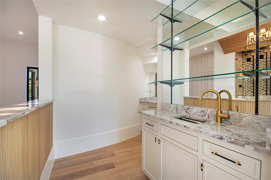 4222 Middleton Road Dallas, TX 75229 - Photo 8 of 40 a bathroom with a sink and a mirror