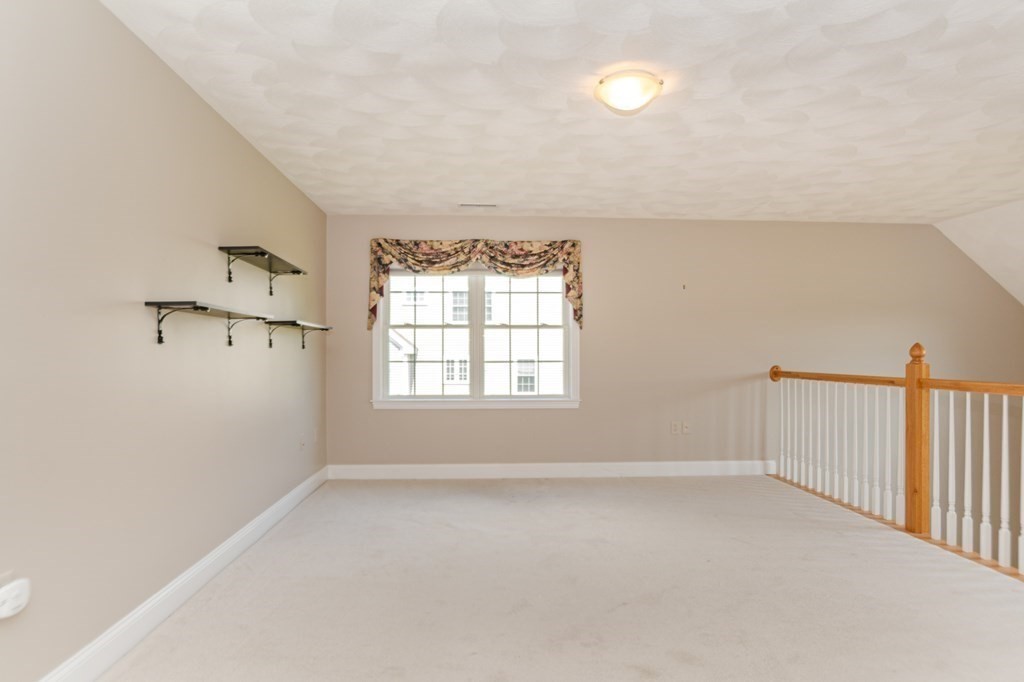 53 Baldwin Road, Unit 403 Billerica, MA 01821 - Photo 22 of 40 an empty room with windows