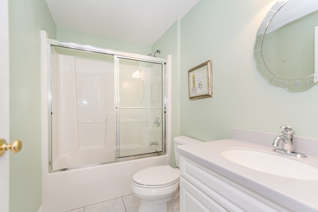 53 Baldwin Road, Unit 403 Billerica, MA 01821 - Photo 29 of 40 a bathroom with a sink a toilet and shower
