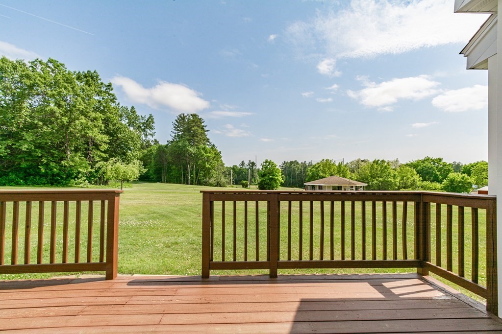53 Baldwin Road, Unit 403 Billerica, MA 01821 - Photo 33 of 40 a view of balcony with wooden floor and fence