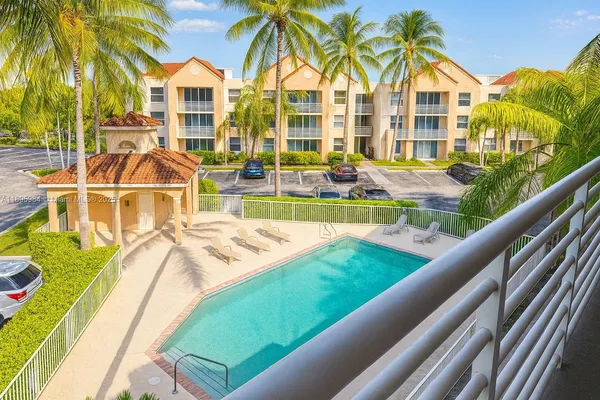 a view of swimming pool with outdoor seating and yard