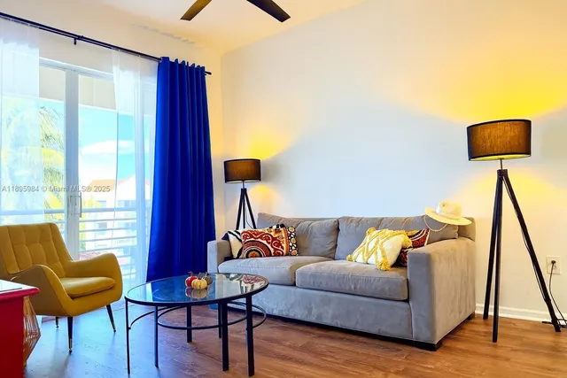 a living room with furniture and a lamp