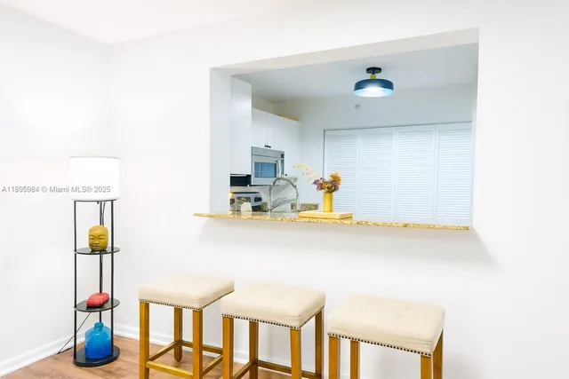 a kitchen with a sink cabinets and appliances