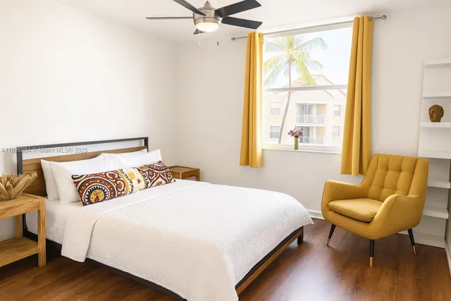 a bedroom with a bed and a chair