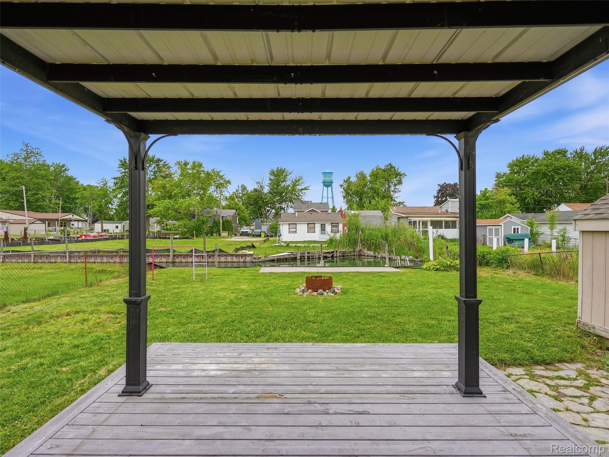 117 Kenyon Road Algonac, MI 48001 - Photo 42 of 47 Covered outdoor deck area featuring wood-finish decking and a metal pergola with decorative posts