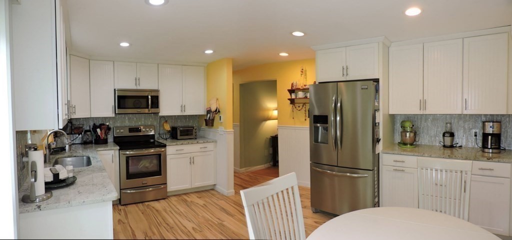 2 Hall Road Webster, MA 01570 - Photo 12 of 42 a kitchen with a refrigerator a sink and a stove