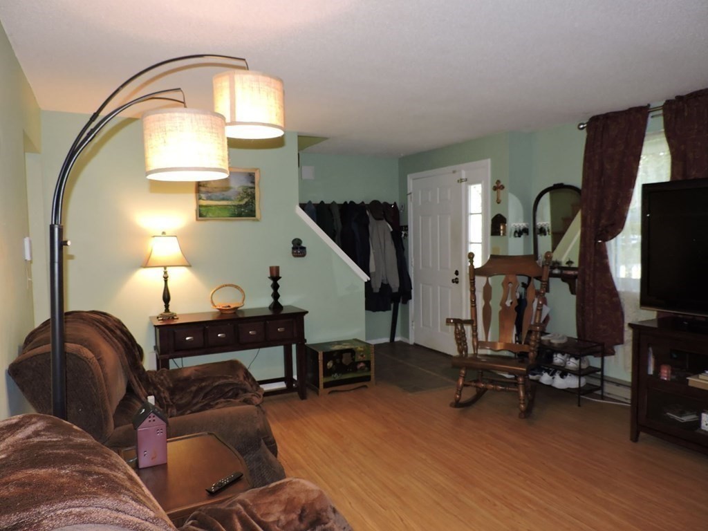 2 Hall Road Webster, MA 01570 - Photo 15 of 42 a view of a livingroom with furniture and a wooden floor