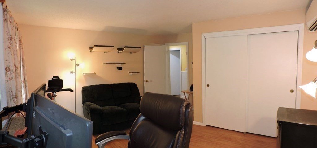 2 Hall Road Webster, MA 01570 - Photo 17 of 42 a living room with furniture and a fireplace