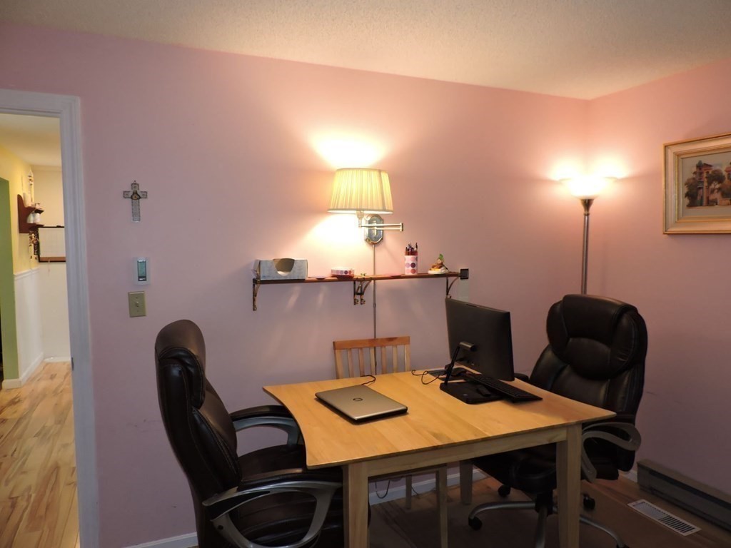 2 Hall Road Webster, MA 01570 - Photo 19 of 42 a view of a workspace with furniture and a lamp