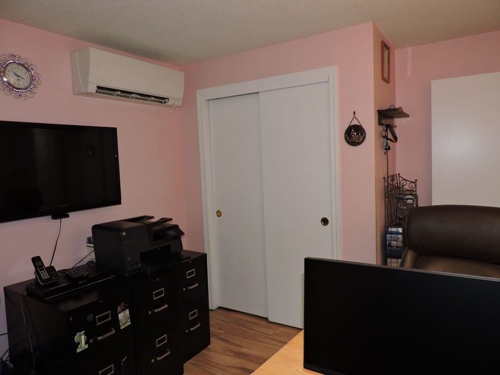 2 Hall Road Webster, MA 01570 - Photo 20 of 42 a living room with furniture and a flat screen tv