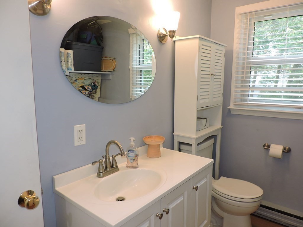 2 Hall Road Webster, MA 01570 - Photo 22 of 42 a bathroom with a toilet sink and mirror