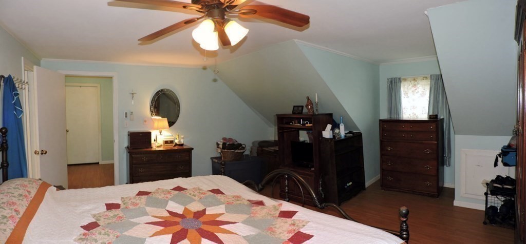 2 Hall Road Webster, MA 01570 - Photo 26 of 42 a bedroom with a bed and a chandelier