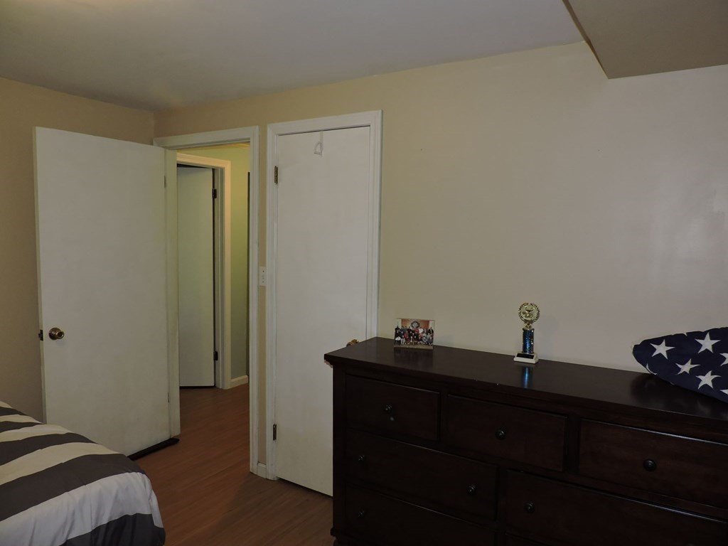 2 Hall Road Webster, MA 01570 - Photo 35 of 42 a bedroom with a sink and a mirror