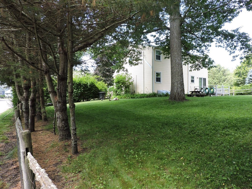 2 Hall Road Webster, MA 01570 - Photo 4 of 42 a view of a garden with large trees