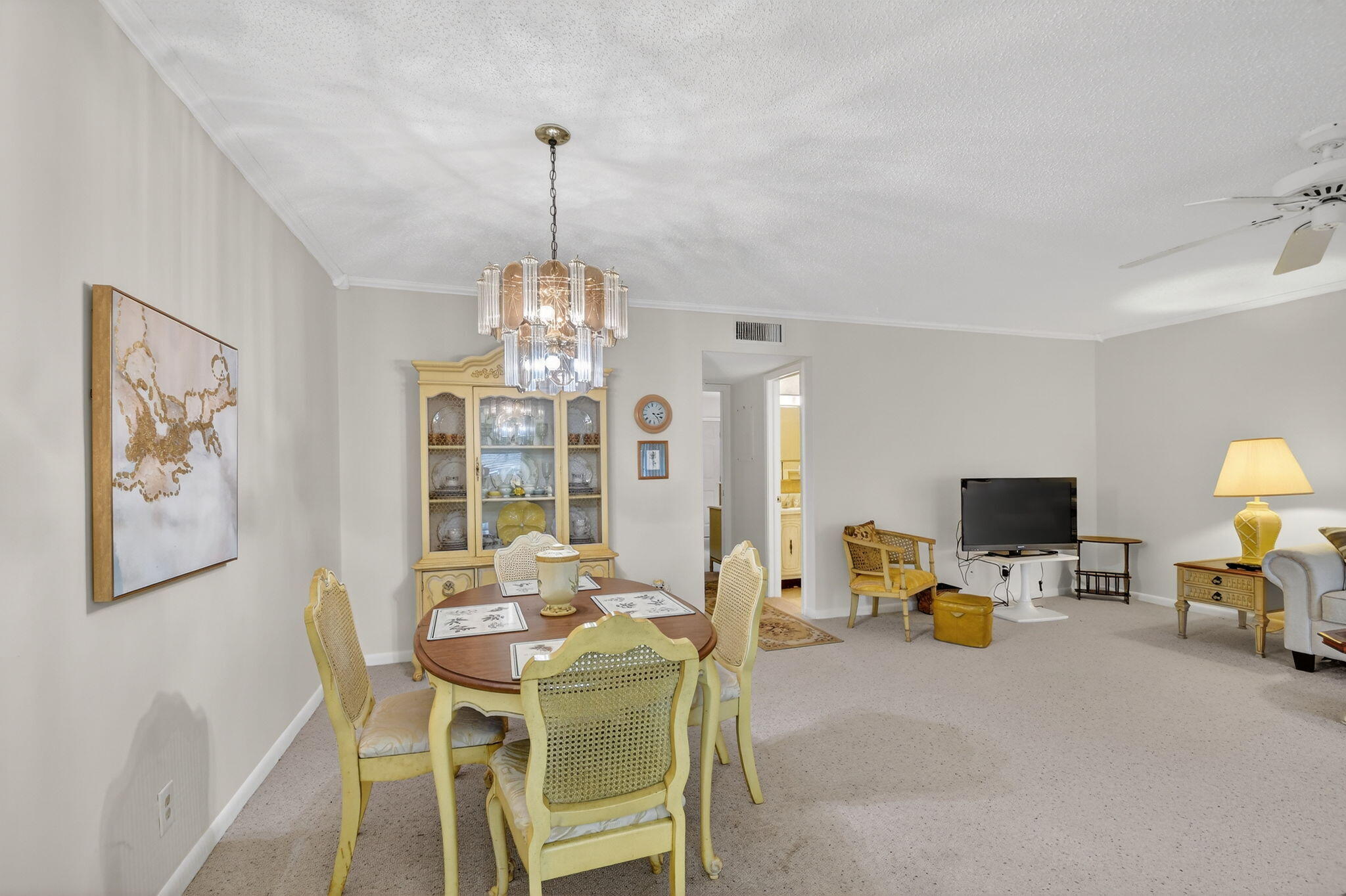 615 High Point Drive, Unit C Delray Beach, FL 33445 - Photo 16 of 48 a view of a dining room with furniture window and wooden floor