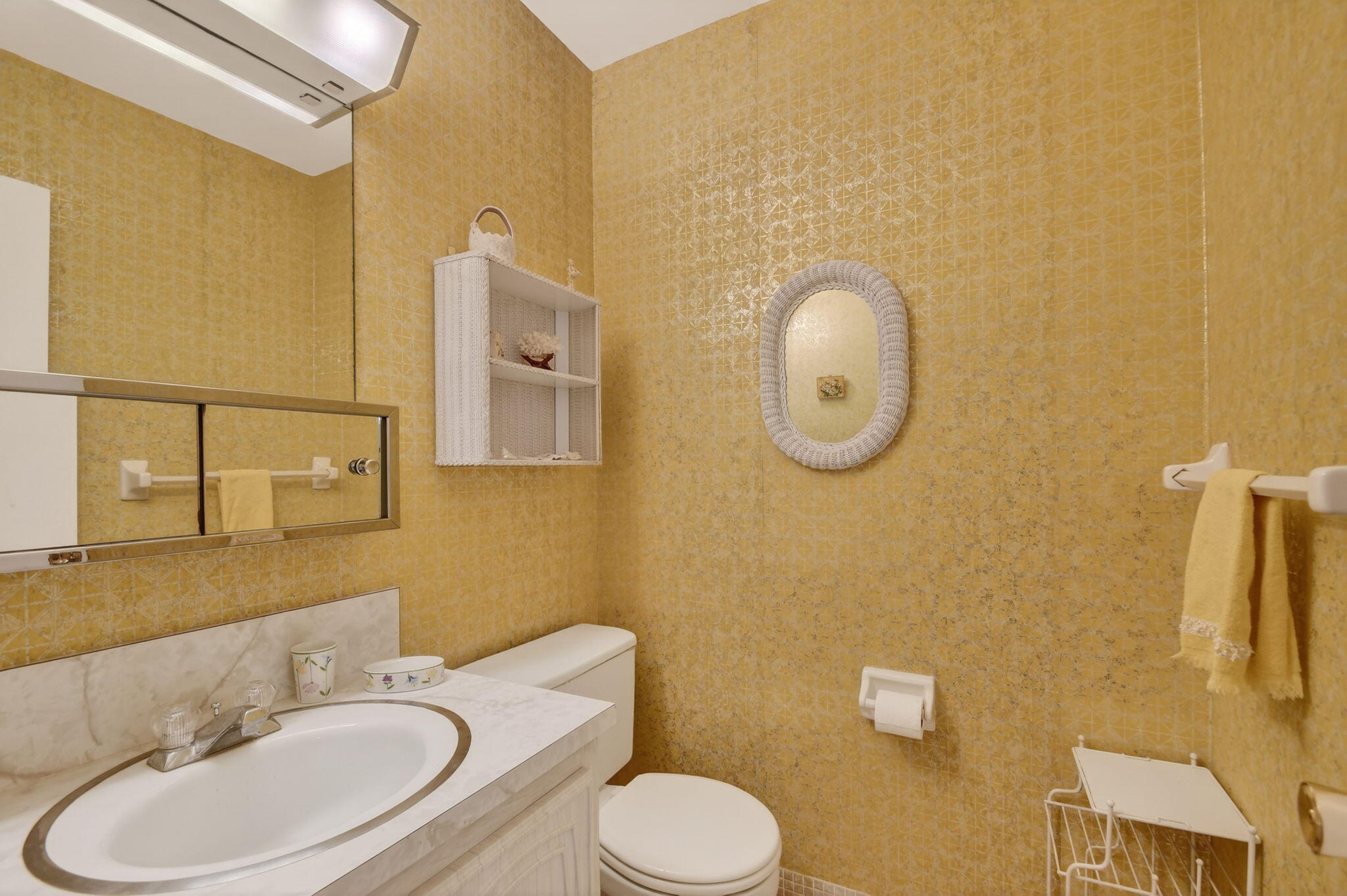 615 High Point Drive, Unit C Delray Beach, FL 33445 - Photo 20 of 48 a bathroom with a toilet sink vanity tub and mirror
