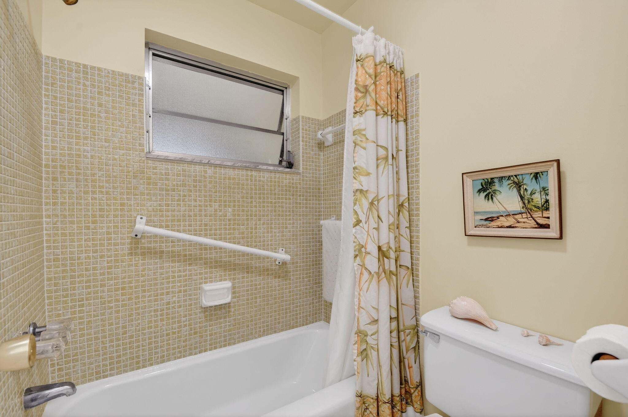 615 High Point Drive, Unit C Delray Beach, FL 33445 - Photo 27 of 48 a bathroom with a toilet and a shower curtain