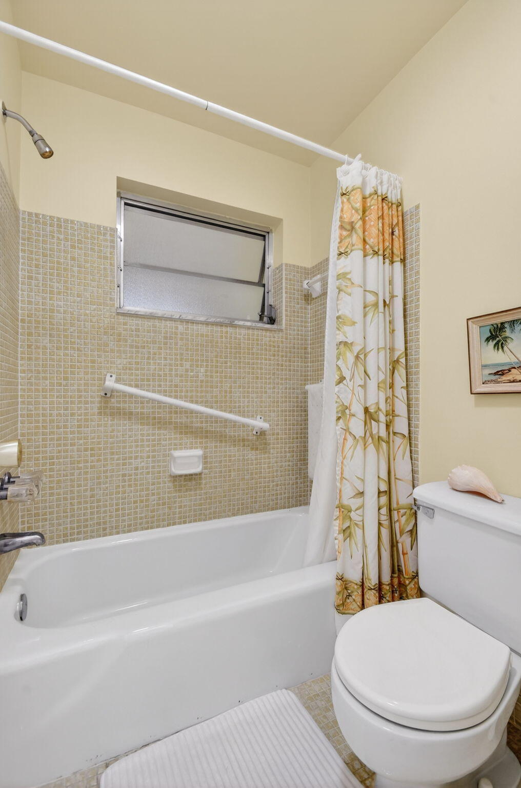 615 High Point Drive, Unit C Delray Beach, FL 33445 - Photo 28 of 48 a bathroom with a toilet and a bathtub