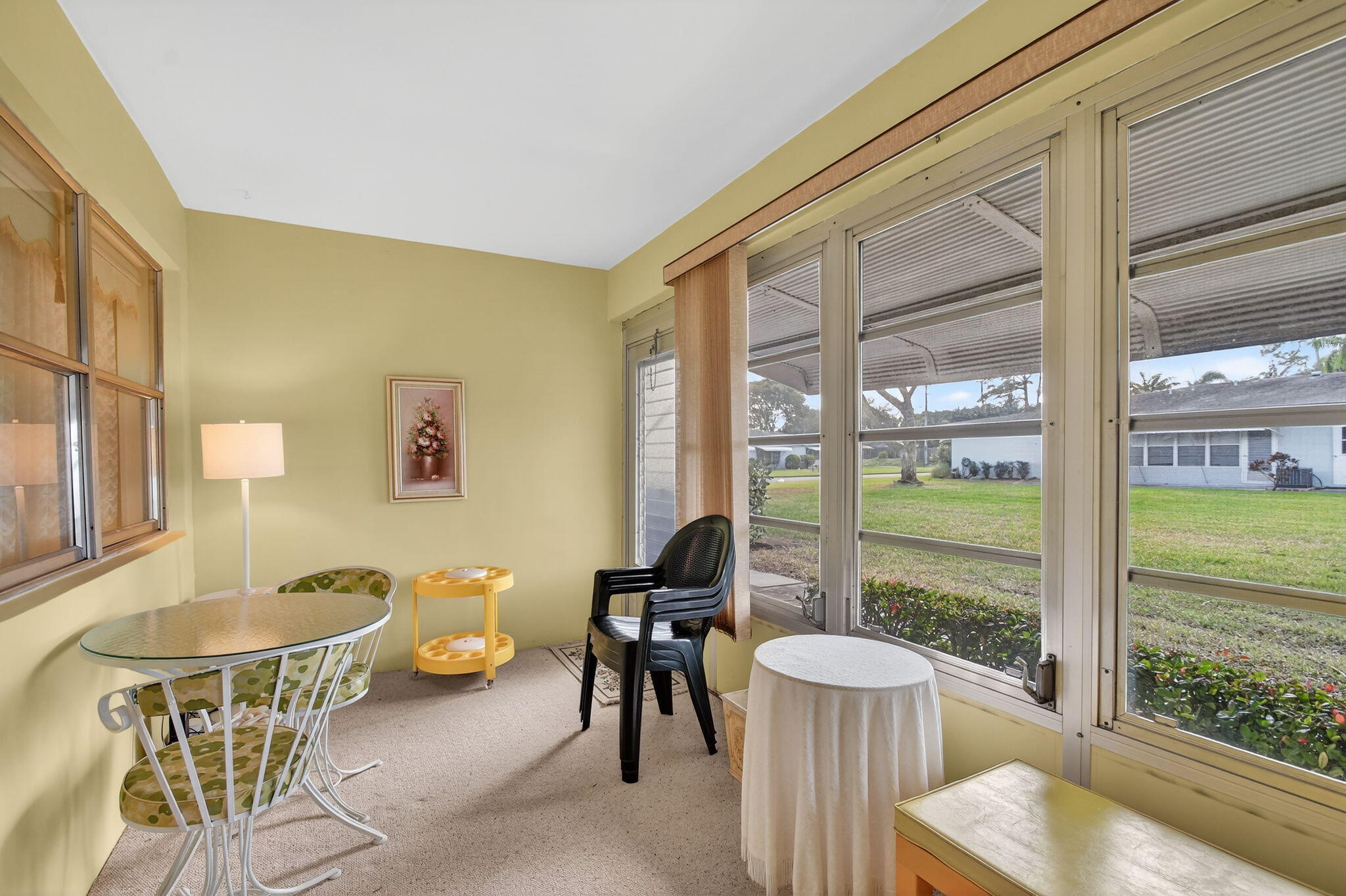 615 High Point Drive, Unit C Delray Beach, FL 33445 - Photo 32 of 48 a living room with furniture and a window