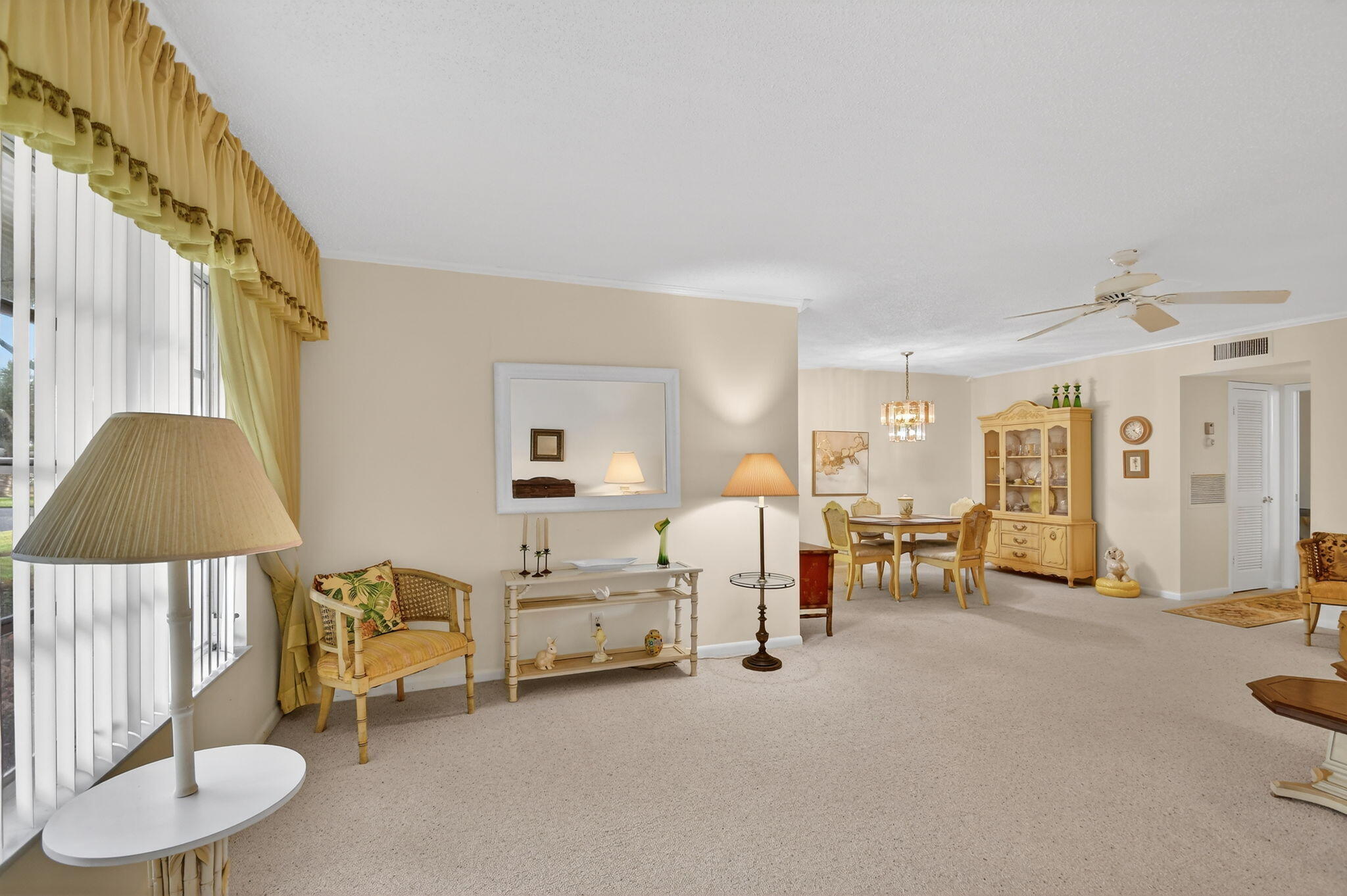 615 High Point Drive, Unit C Delray Beach, FL 33445 - Photo 5 of 48 a living room with furniture and a lamp